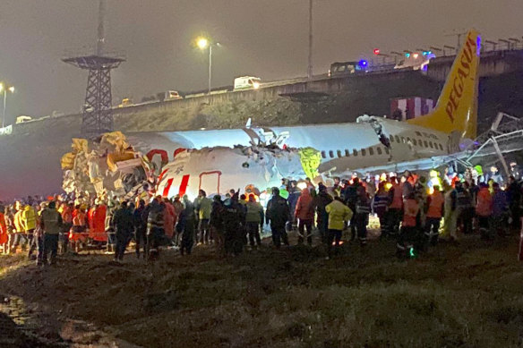 Passengers were seen evacuating through cracks in the plane following the crash.