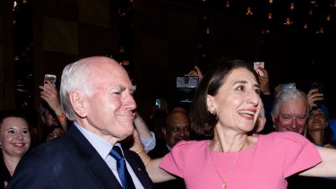Premier Gladys Berejiklian with former prime minister John Howard at the Sofitel Wentworth after her NSW election victory on Saturday night.
 