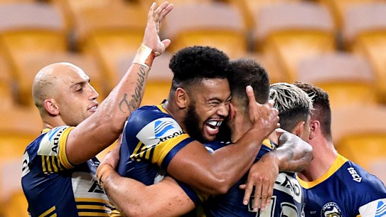 Waqa Blake celebrates his try for the Eels against the Broncos at Suncorp Stadium on Thursday night.