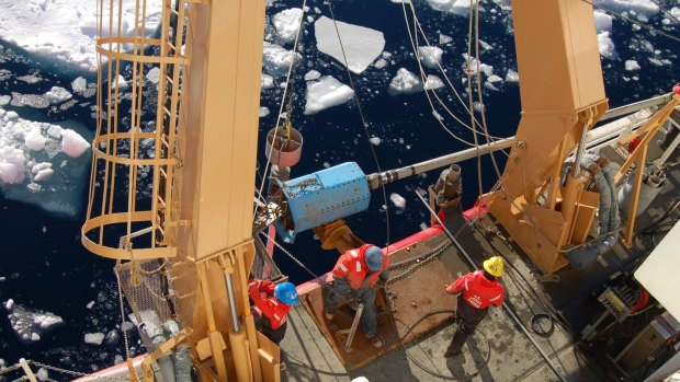 Researchers aboard the US Coast Guard Cutter Healy gather sediment cores from along the continental slope east of the Mackenzie River in the eastern Beaufort Sea. They were searching for evidence of a a huge glacial flood near where the Mackenzie River enters the Arctic Ocean,