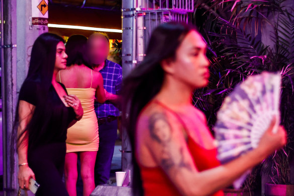 Foreigners meet locals at P. Burgos Street in the city of Makati.