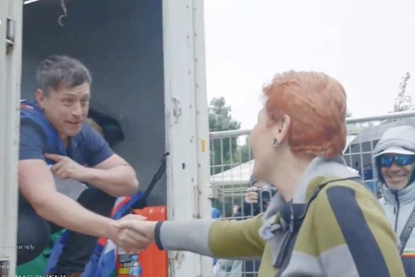 Morgan Jonas welcomes Pauline Hanson to a far-right anti-immigration rally she flew to Melbourne to speak at in late November 2025.
