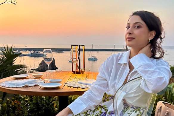 Symonne Torpy at Cala Luna in Cefalu, Sicily – after pricking her fingers on a sea urchin. 