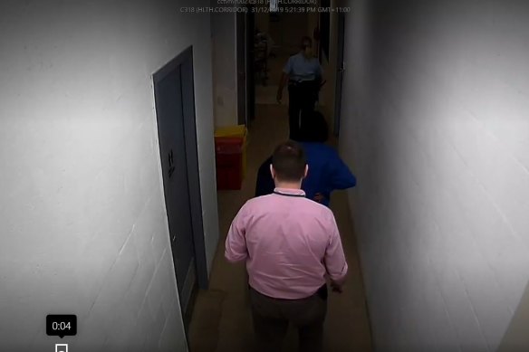 Dr Sean Runacres in a CCTV image following Veronica Nelson through a corridor at the prison.
