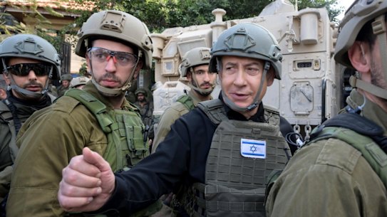 Israeli Prime Minister Benjamin Netanyahu receives a security briefing with commanders and soldiers in the northern Gaza Strip on Christmas Day.