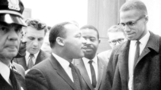 Martin Luther King jnr and Malcolm X wait for a press conference in March 1964. 