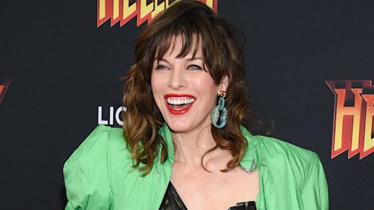 Actress Milla Jovovich dives into the neon trend.