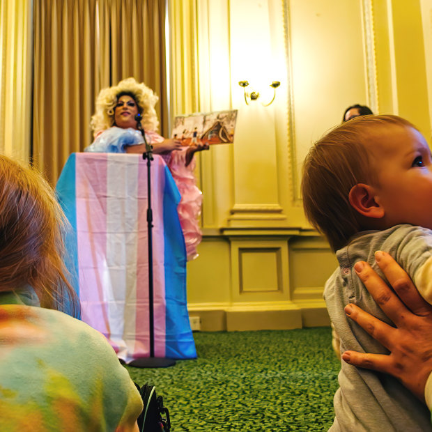 Drag queen Frock Hudson reads for young children and their families at Parliament House on Wednesday.