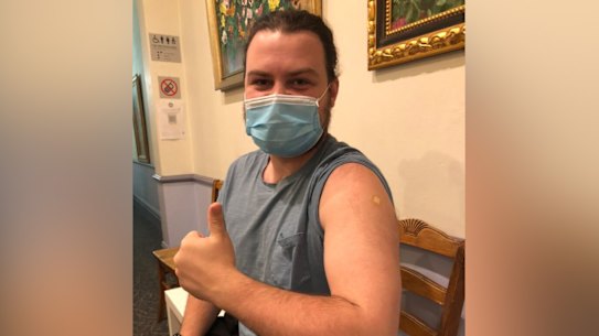Jake FitzSimons gives the thumbs up after his COVID vaccination.