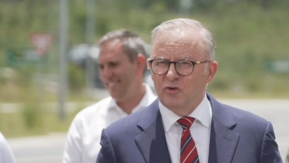 Prime Minister Anthony Albanese in Gympie, Queensland, on Monday flanked by Treasurer Jim Chalmers.