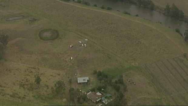The crash site is in the middle of a field next to a property in Woodville. 