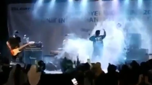 Jakarta pop band Seventeen are seen performing on stage at a resort in Tanjung Lesung moments before before the wave strikes and sweeps them into the audience.