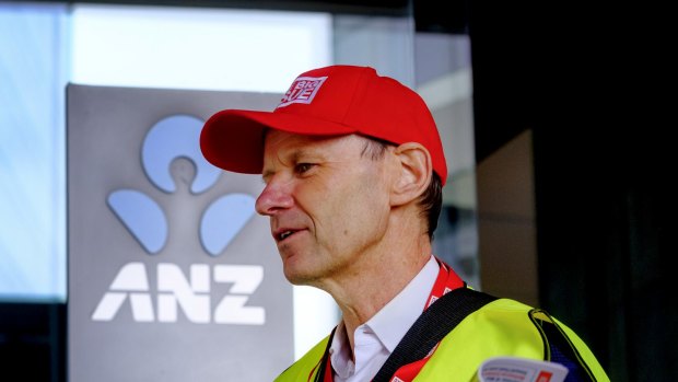 Shayne Elliott sells copies of the Big Issue outside the ANZ's Melbourne office.