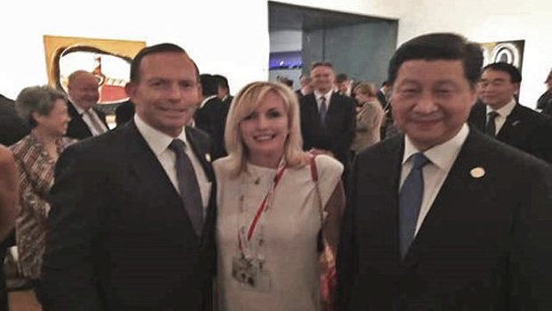 Former Prime Minister Tony Abbott with Christine Holgate, chief executive of Australia Post and Chinese President Xi Jinping at the G20 in the photo taken on Ms Holgate's smuggled iPhone. 
