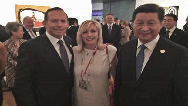 Former Prime Minister Tony Abbott with Christine Holgate, chief executive of Australia Post and Chinese President Xi Jinping at the G20 in the photo taken on Ms Holgate's smuggled iPhone. 