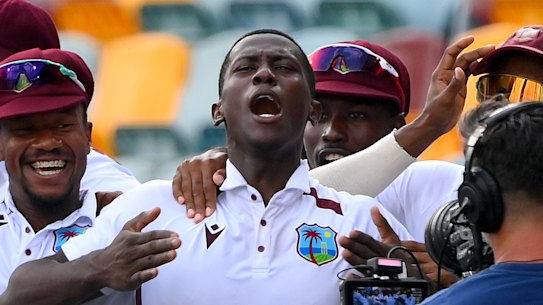 Shamar Joseph celebrates a remarkable Test victory with teammates at the Gabba.