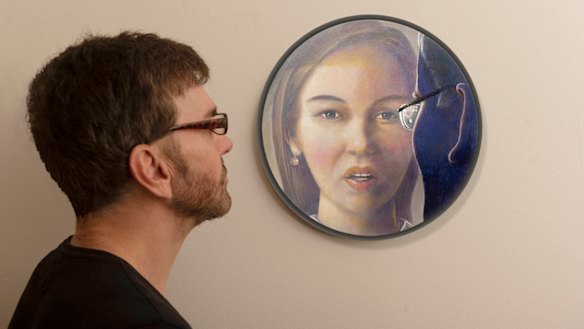Artist Darren Pryce with his portrait of Brittany Higgins.