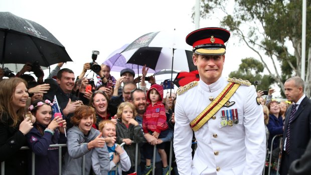 Prince Harry has some fun with the crowd in Canberra. 