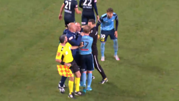 Banned: Jean Paul de Marigny (centre) clashes with Sydney's David Carney.