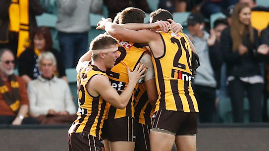 The Hawks celebrate their comeback win.