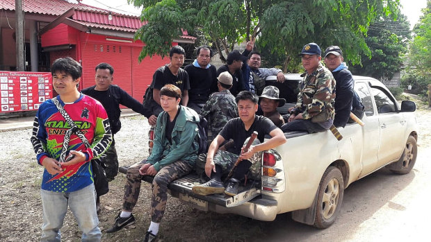 Members of the Thai military, Forest Rangers and birds' nest team at base camp.