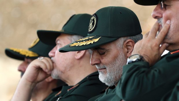 General Qassem Soleimani, centre, the head of Quds Force of Iran's Revolutionary Guard.