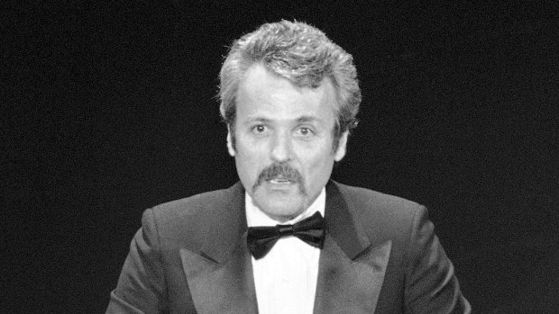 William Goldman accepts his Oscar at Academy Awards in Los Angeles, for screenplay from other medium for "All The President's Men." , 1977.