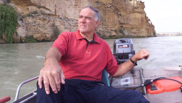 Neil Kerley in his dingy on the Murray River at Walker Flat.