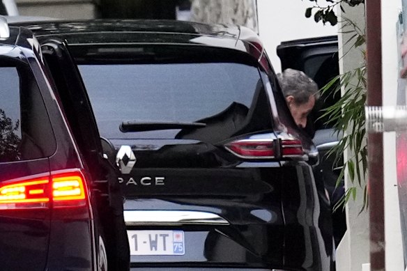 Former French president Nicolas Sarkozy arrives at his home after being released from prison on Monday.