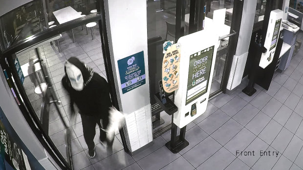 A still from CCTV footage of a man wanted by ACT Police in relation to an aggravated robbery on Monday.