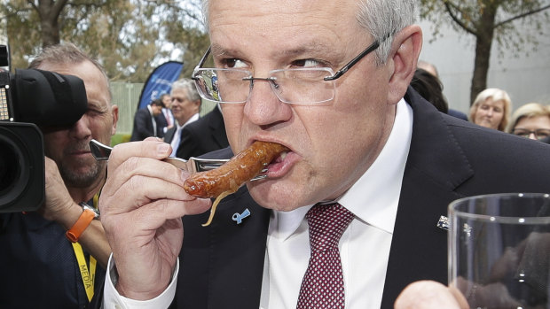 Prime Minister Scott Morrison knows what to do with a sausage.