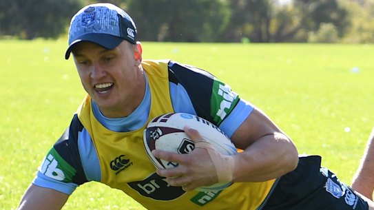 Learning the ropes: Jack Wighton goes to ground with Tom Trbojevic following at Blues training.
