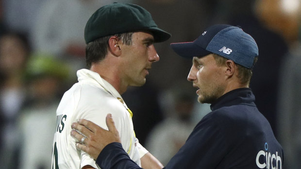 Pat Cummins and Joe Root shake hands at the conclusion of the fifth Test in Hobart.