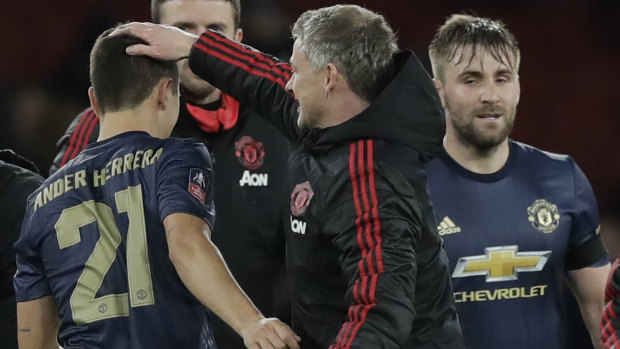 United's caretaker coach Ole Gunnar Solskjaer with the players after the win. 