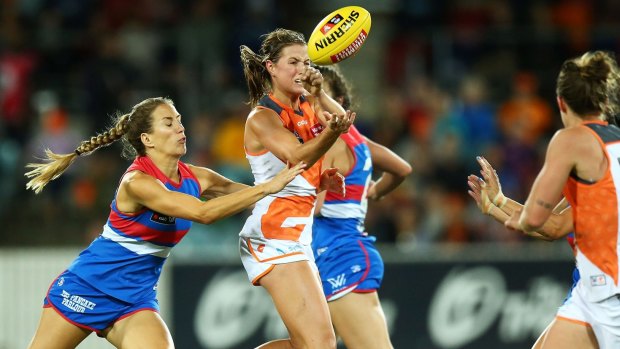 Nicola Barr of the Giants handballs during the 2017 AFLW season.