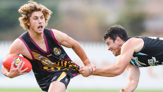 A kick of the soccer ball at cricket training led to Tigers midfielder Kel Evans becoming one of the best players in Canberra.