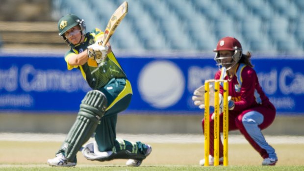Green and gold: Kimmince in action for Australia against the West Indies at Manuka Oval.