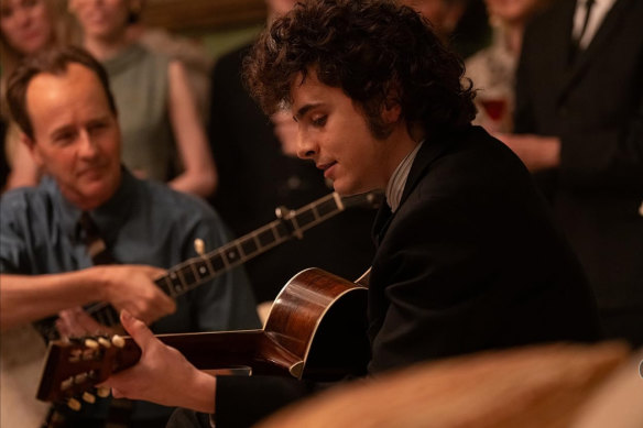 Timothee Chalamet as Bob Dylan, with Edward Norton (left) as Pete Seeger.