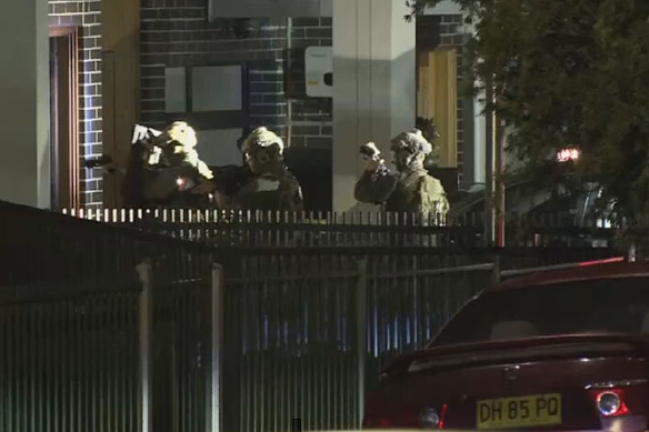 Police dressed in camouflage armed with rifles and pistols stormed the Fairfield West home.