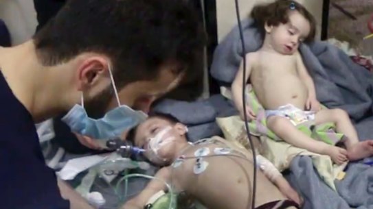 Medical workers treat toddlers following the gas attack in the opposition-held town of Douma, in eastern Ghouta, near Damascus,on April 8 last year.
