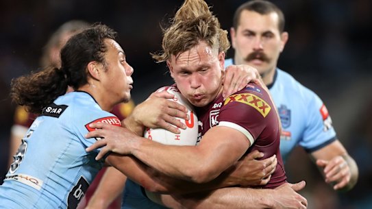 SYDNEY, AUSTRALIA - JUNE 08: Reuben Cotter of the Maroons is tackled during game one of the 2022 State of Origin series between the New South Wales Blues and the Queensland Maroons at Accor Stadium on June 08, 2022 in Sydney, Australia. (Photo by Cameron Spencer/Getty Images)