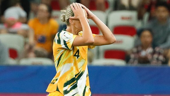 Australia's Alanna Kennedy leaves the pitch after receiving king a red card.
