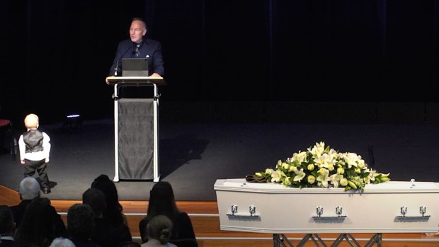 Kayden regularly moved around the service, touching his father’s casket.