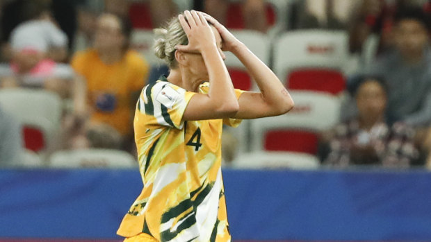 Australia's Alanna Kennedy leaves the pitch after receiving a red card.
