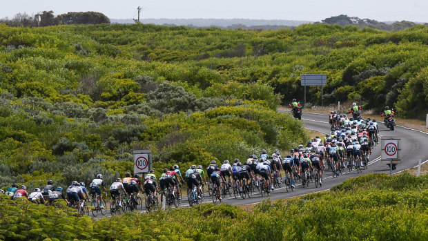 The peloton makes its way past the Bay Of Martyrs.

