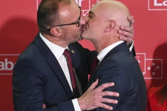 Andrew Barr kisses his partner Anthony Toms on election night.