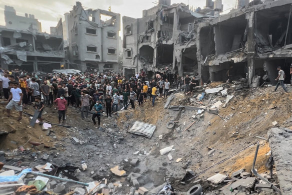 Palestinians search for survivors following an Israeli airstrike in the Jabaliya refugee camp.