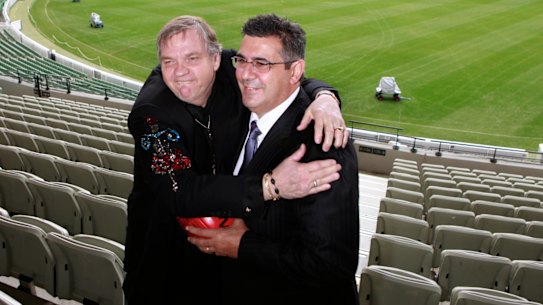 Former AFL CEO with performer Meat Loaf ahead of the 2011 grand final.