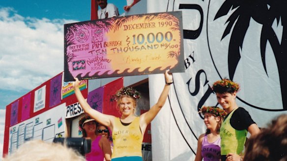 Pam Burridge collects a winner's cheque in Girls Can't Surf.