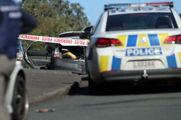 Armed police at the scene after the offender fled the scene in West Auckland on Friday morning.